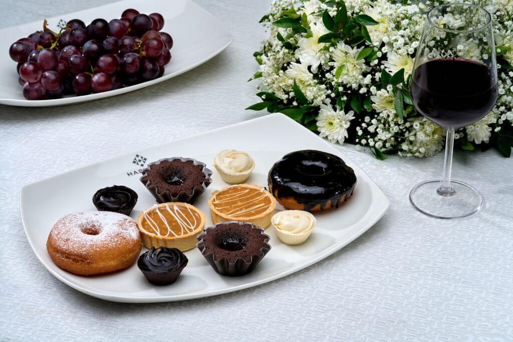 Harvest Caterers Kochi offering a premium selection of assorted desserts and pastries.