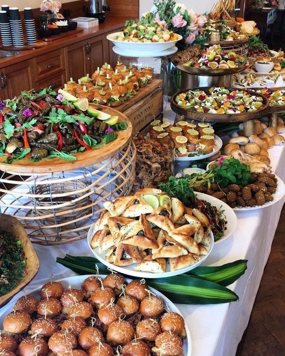 A diverse buffet spread with salads, starters, and baked appetizers, offering inspiration for Kerala wedding menu ideas.