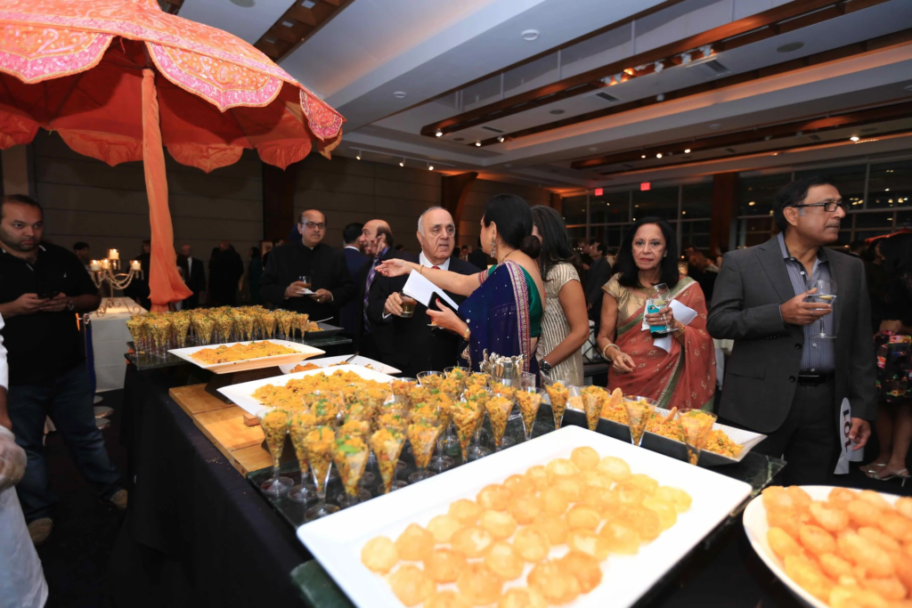 Multicultural wedding menu featuring Indian and international dishes served at a live wedding reception